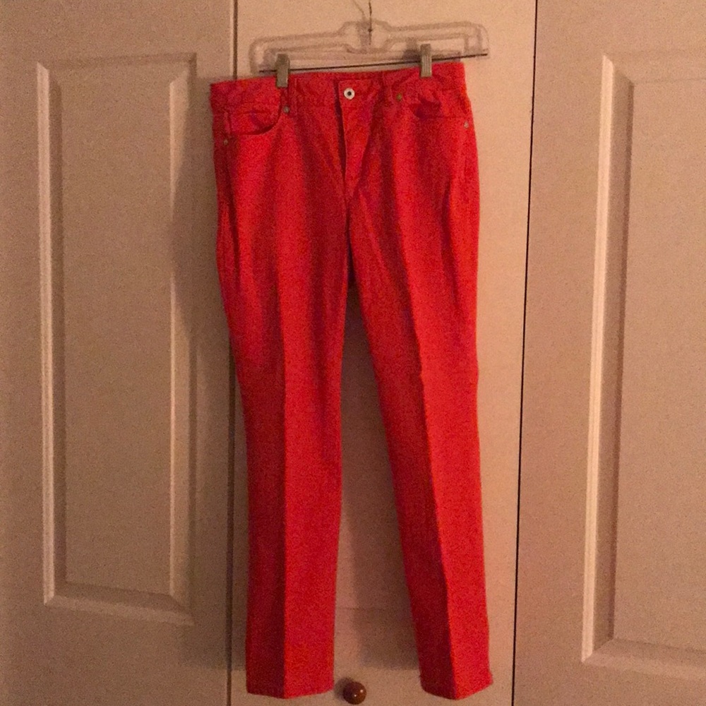 Orange jeans. Front zipper, side and back pockets.